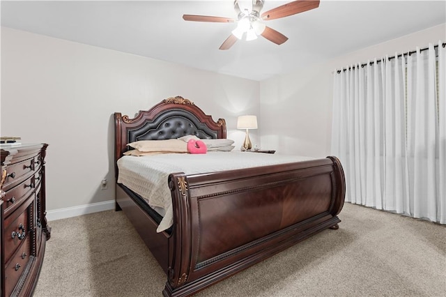 bedroom featuring ceiling fan and light colored carpet