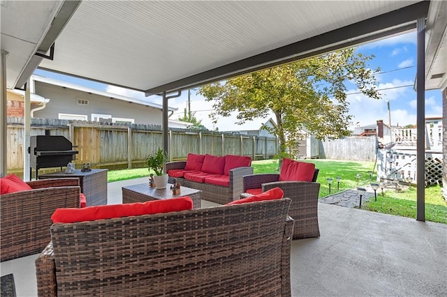 view of patio with grilling area and an outdoor hangout area