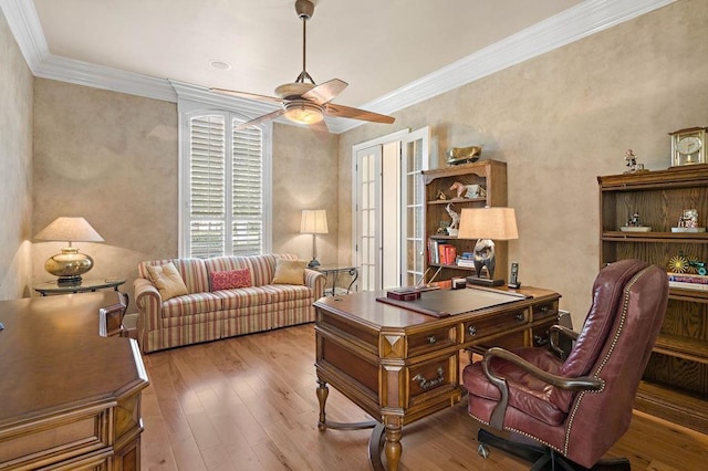 office space with hardwood / wood-style floors, crown molding, and ceiling fan