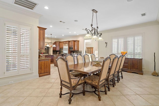 tiled dining room with crown molding and a chandelier