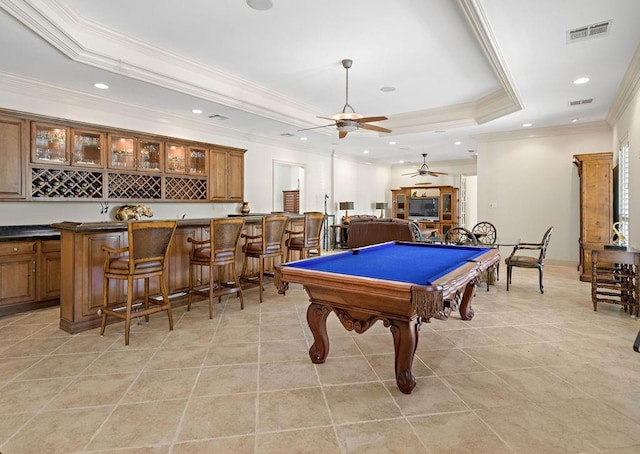 recreation room featuring pool table, bar area, ceiling fan, a raised ceiling, and crown molding