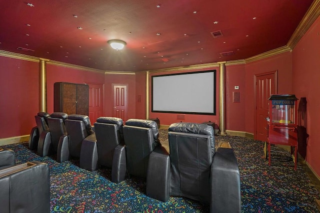 carpeted home theater room with ornamental molding