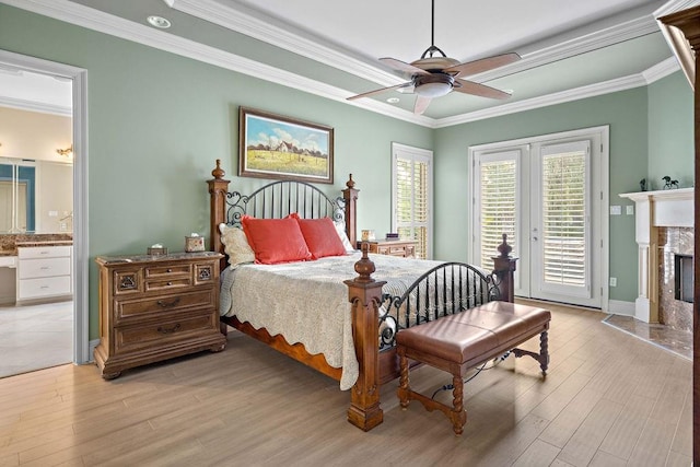 bedroom featuring ceiling fan, ornamental molding, and access to exterior