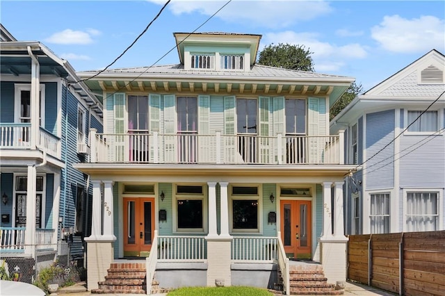 view of front of home with a porch and a balcony