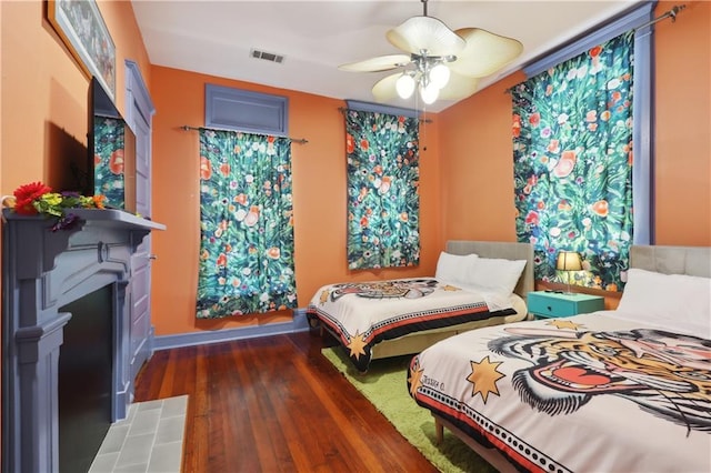 bedroom featuring dark wood-type flooring and ceiling fan