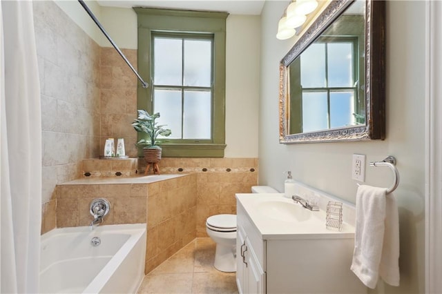 bathroom featuring tile patterned flooring, vanity, tile walls, and toilet