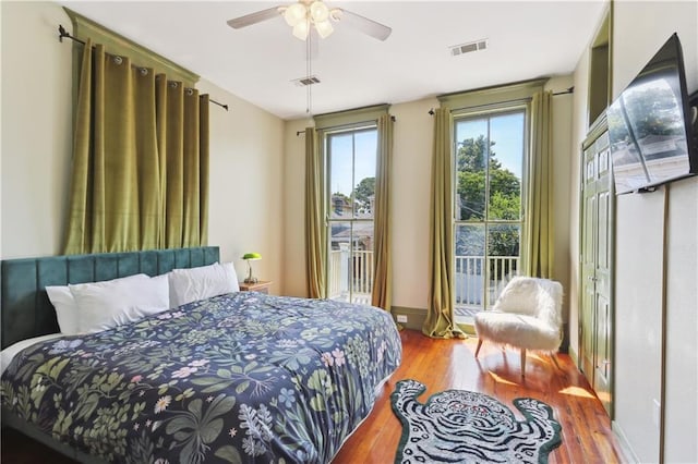 bedroom with hardwood / wood-style flooring and ceiling fan