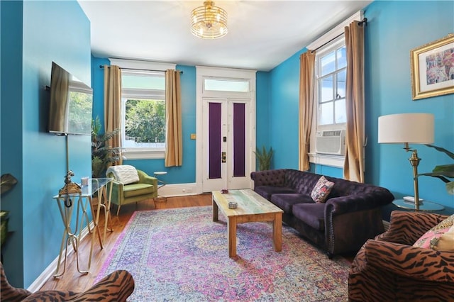 living room featuring cooling unit and wood-type flooring