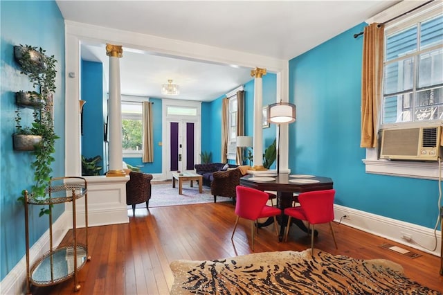 sitting room with cooling unit, french doors, and hardwood / wood-style flooring