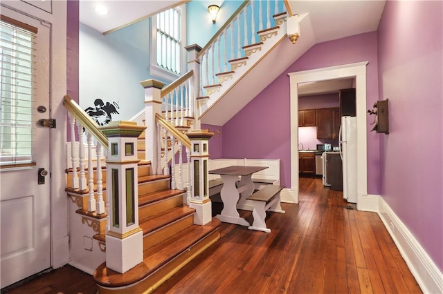 stairway with hardwood / wood-style floors