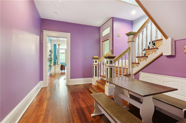 hall with dark hardwood / wood-style floors