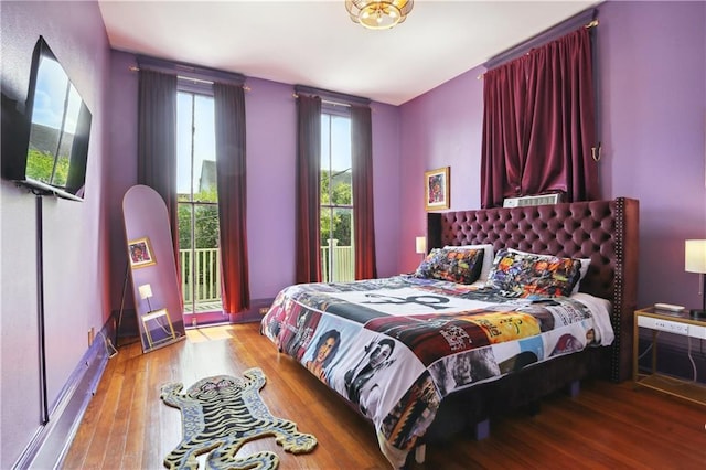 bedroom featuring access to outside and light wood-type flooring