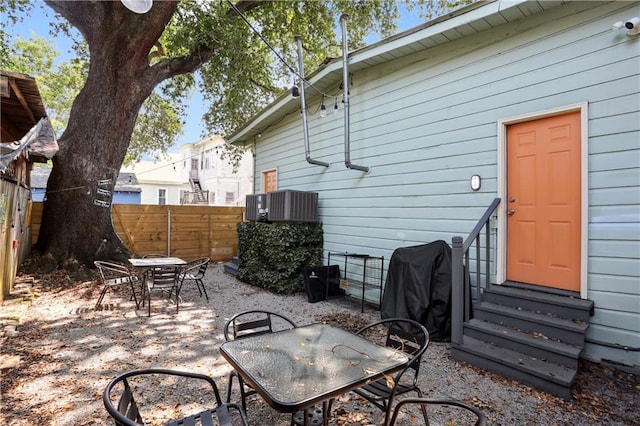 view of patio with grilling area and central air condition unit