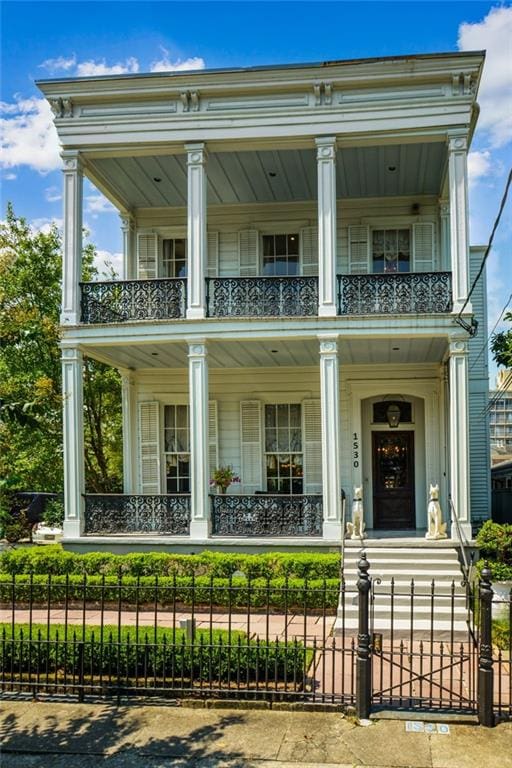 view of front of house featuring a balcony