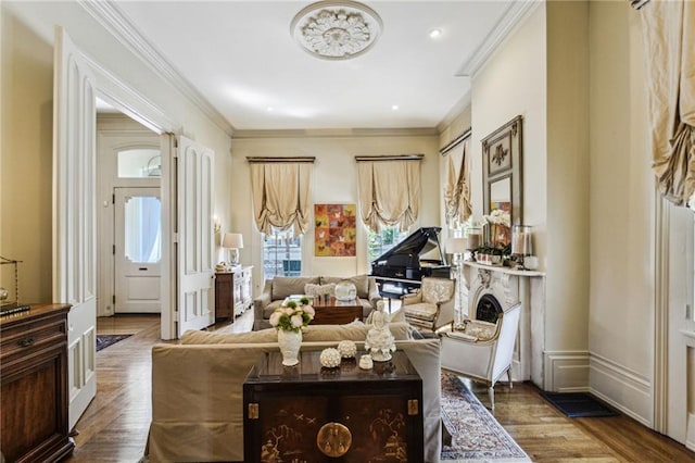 sitting room with crown molding and dark hardwood / wood-style flooring