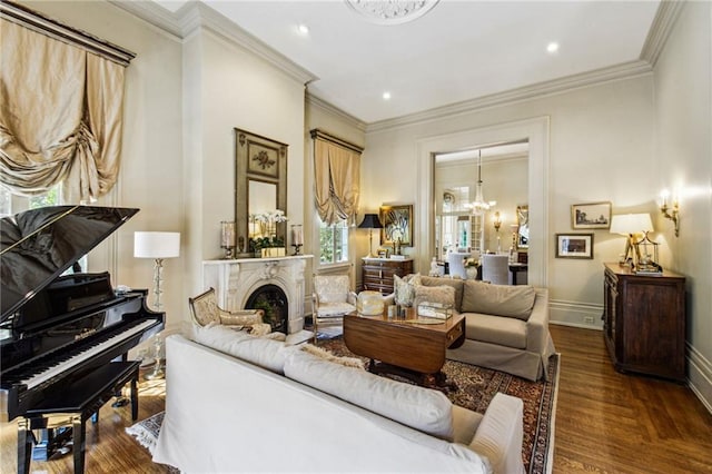 living area with an inviting chandelier, dark hardwood / wood-style floors, and ornamental molding