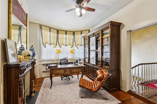 office area featuring ceiling fan and dark hardwood / wood-style flooring