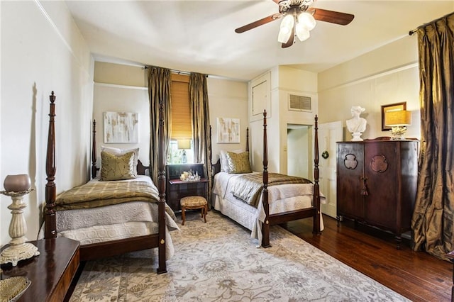 bedroom with wood-type flooring and ceiling fan