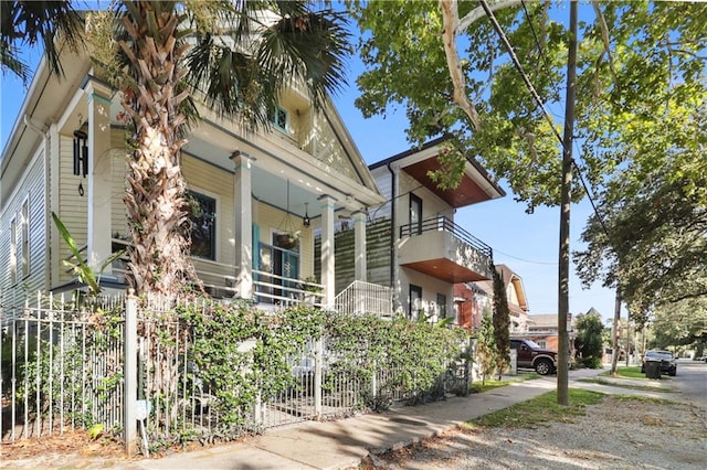 view of side of home featuring a balcony