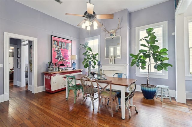 dining space featuring ceiling fan, plenty of natural light, and hardwood / wood-style floors