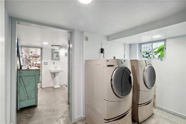 laundry room with sink and separate washer and dryer