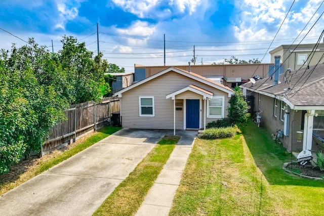 bungalow-style house featuring a front yard