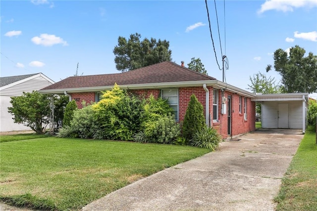 single story home featuring a front yard, brick siding, driveway, and an attached carport