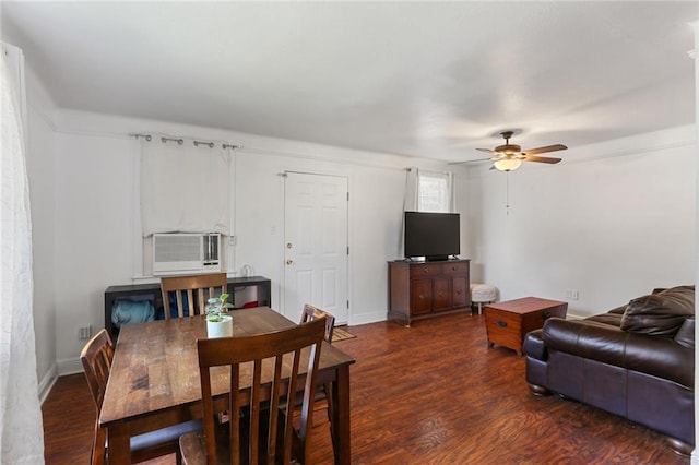 dining space with dark wood-type flooring, a ceiling fan, and baseboards