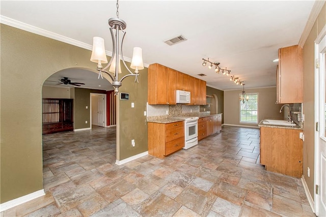 kitchen featuring tile patterned floors, pendant lighting, ceiling fan with notable chandelier, and white appliances