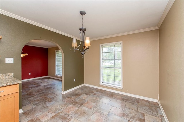 unfurnished room with light tile patterned floors, ornamental molding, and an inviting chandelier