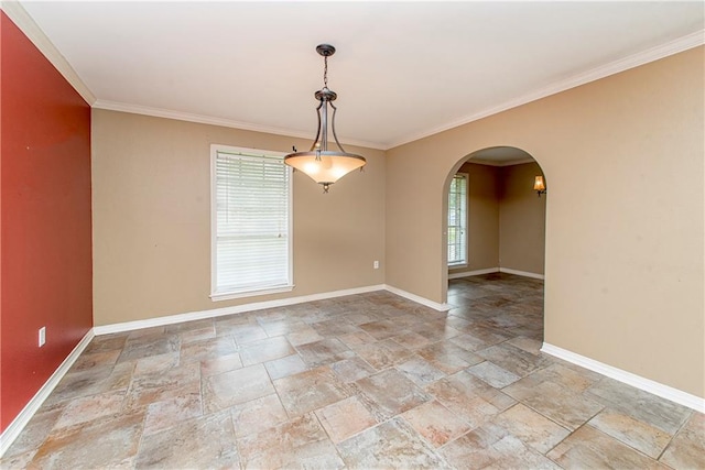 tiled spare room featuring crown molding