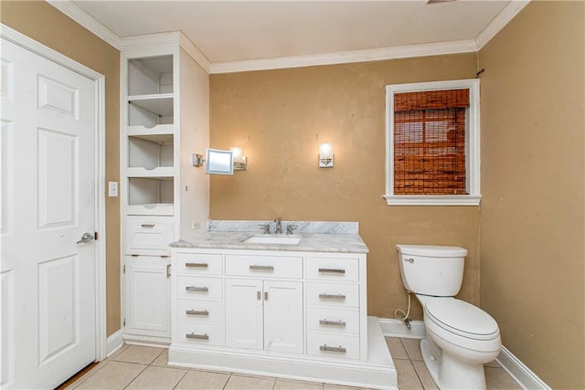 bathroom with tile patterned floors, vanity, toilet, and crown molding