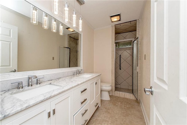 bathroom featuring double sink vanity, toilet, ornamental molding, and tile patterned flooring