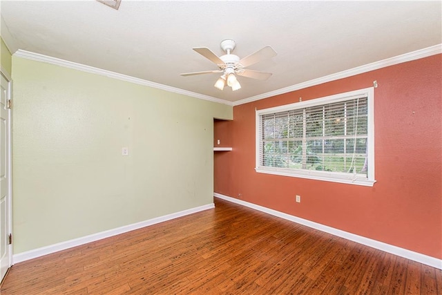 empty room featuring ceiling fan, crown molding, and wood-type flooring