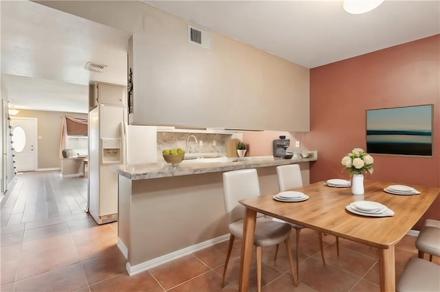 dining room featuring tile patterned flooring