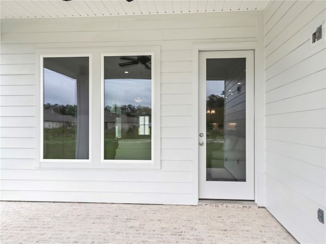 entrance to property with a patio area