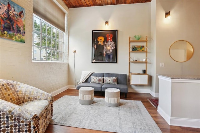 living area featuring dark hardwood / wood-style floors and wood ceiling