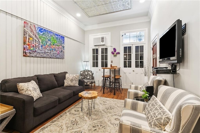 719 St Ann St Unit 2, New Orleans, LA 70116 - living room with wood finished floors, french doors, crown molding, and recessed lighting