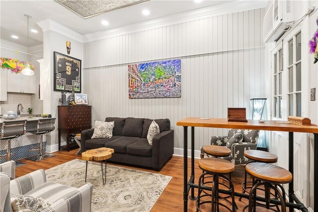 719 St Ann St Unit 2, New Orleans, LA 70116 - living area featuring crown molding and wood finished floors
