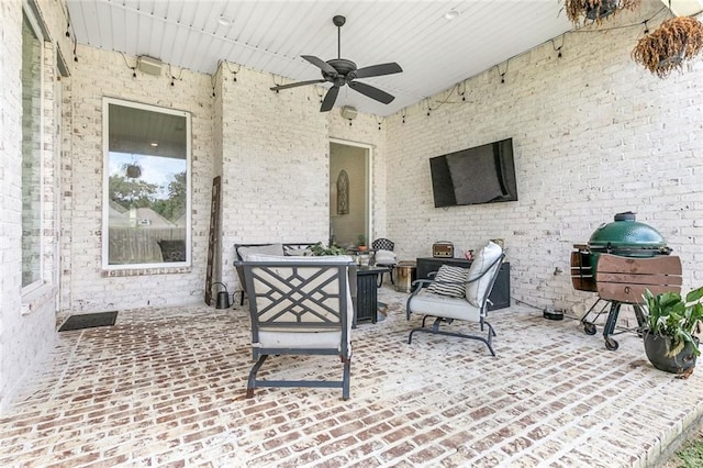 view of patio featuring ceiling fan