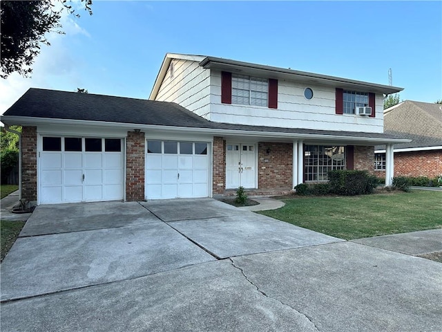 view of front of home with a garage, cooling unit, and a front yard