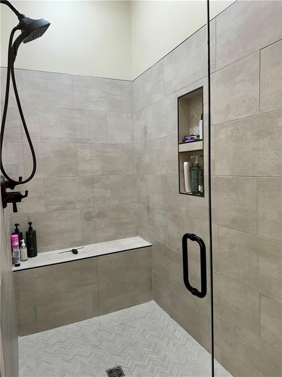 bathroom featuring an enclosed shower