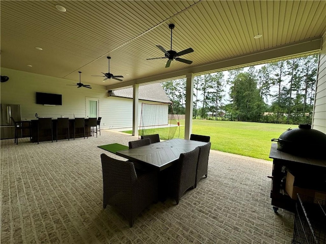 view of patio featuring ceiling fan