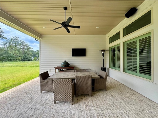 view of patio featuring ceiling fan