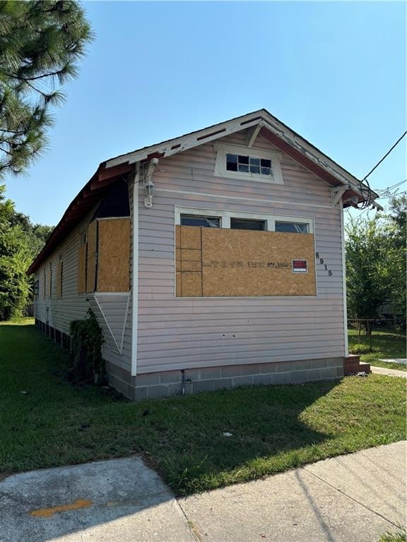 view of property exterior featuring a yard