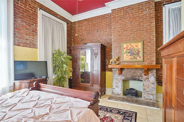 bedroom with brick wall, ornamental molding, and light tile patterned flooring