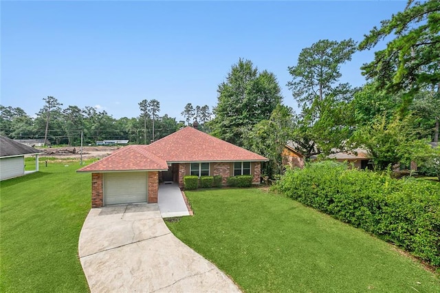 ranch-style house featuring a garage and a front yard