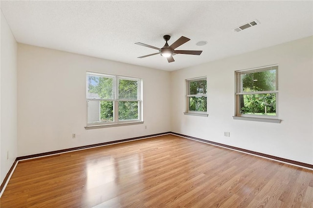 unfurnished room featuring light hardwood / wood-style floors and ceiling fan