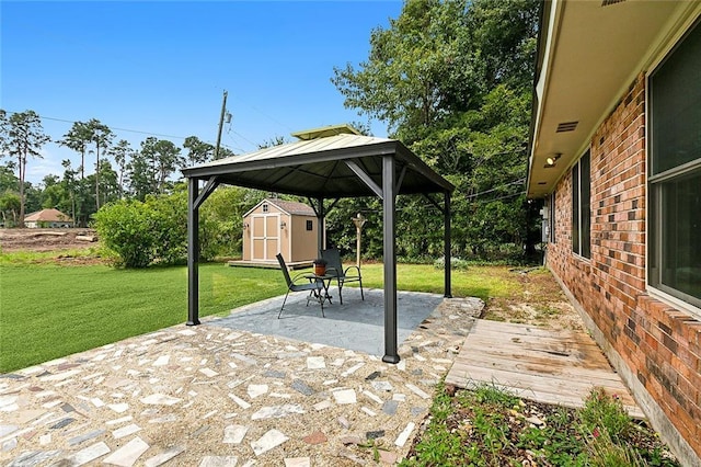217 Robinhood Dr, Covington, LA 70433 - view of patio / terrace featuring a gazebo, an outbuilding, and a storage shed