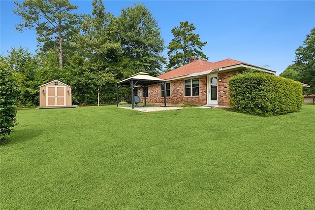 view of yard featuring a storage unit and a gazebo